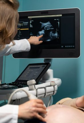 gynecologist-performing-ultrasound-consultation (1)